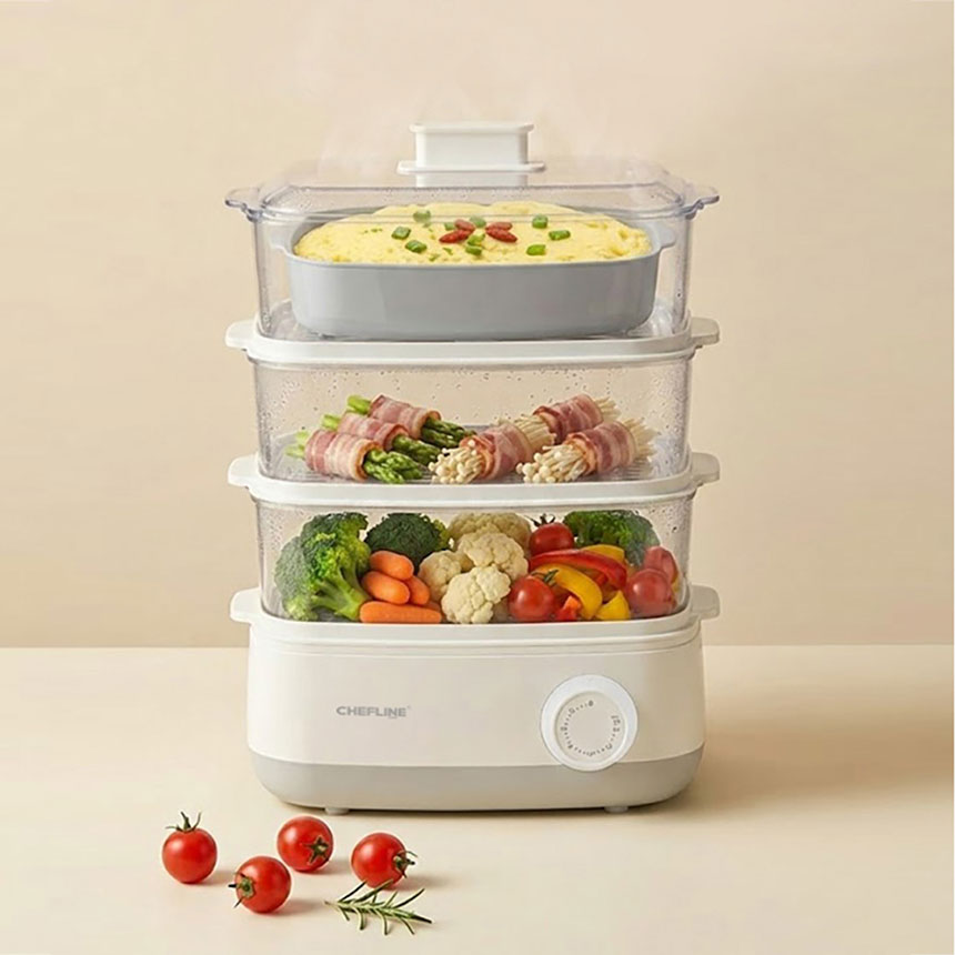 3단전기찜기에 계란, 만두, 채소를 올린 라이프스타일 이미지